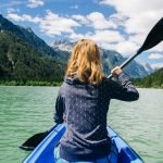 kayak surrounded by beautiful mountains